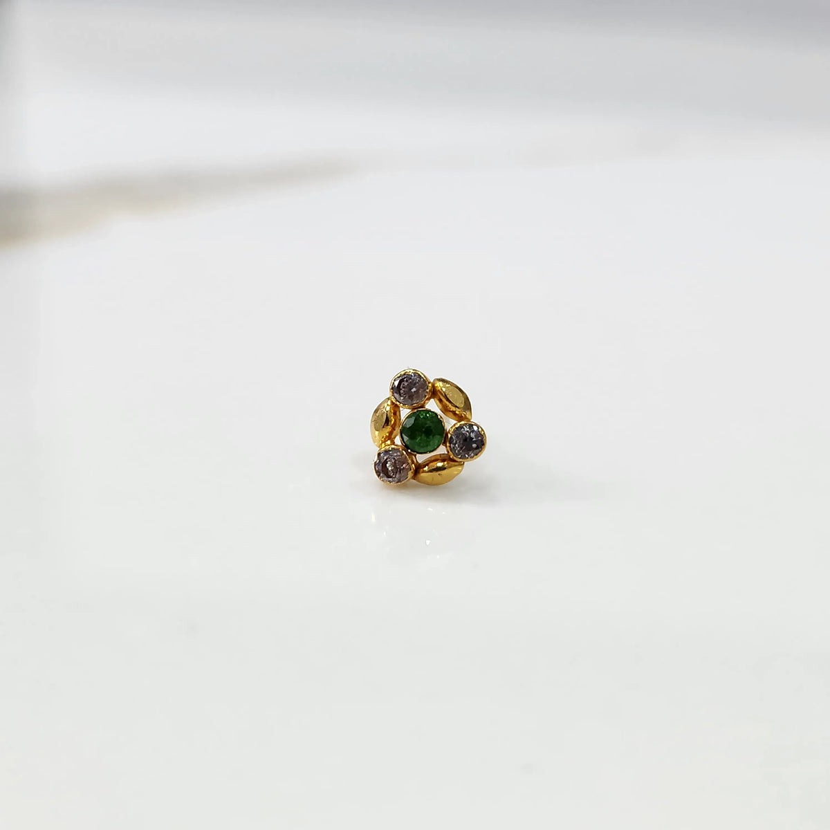 Gold ring with green and multicolor gemstone leaf-petal design, front view