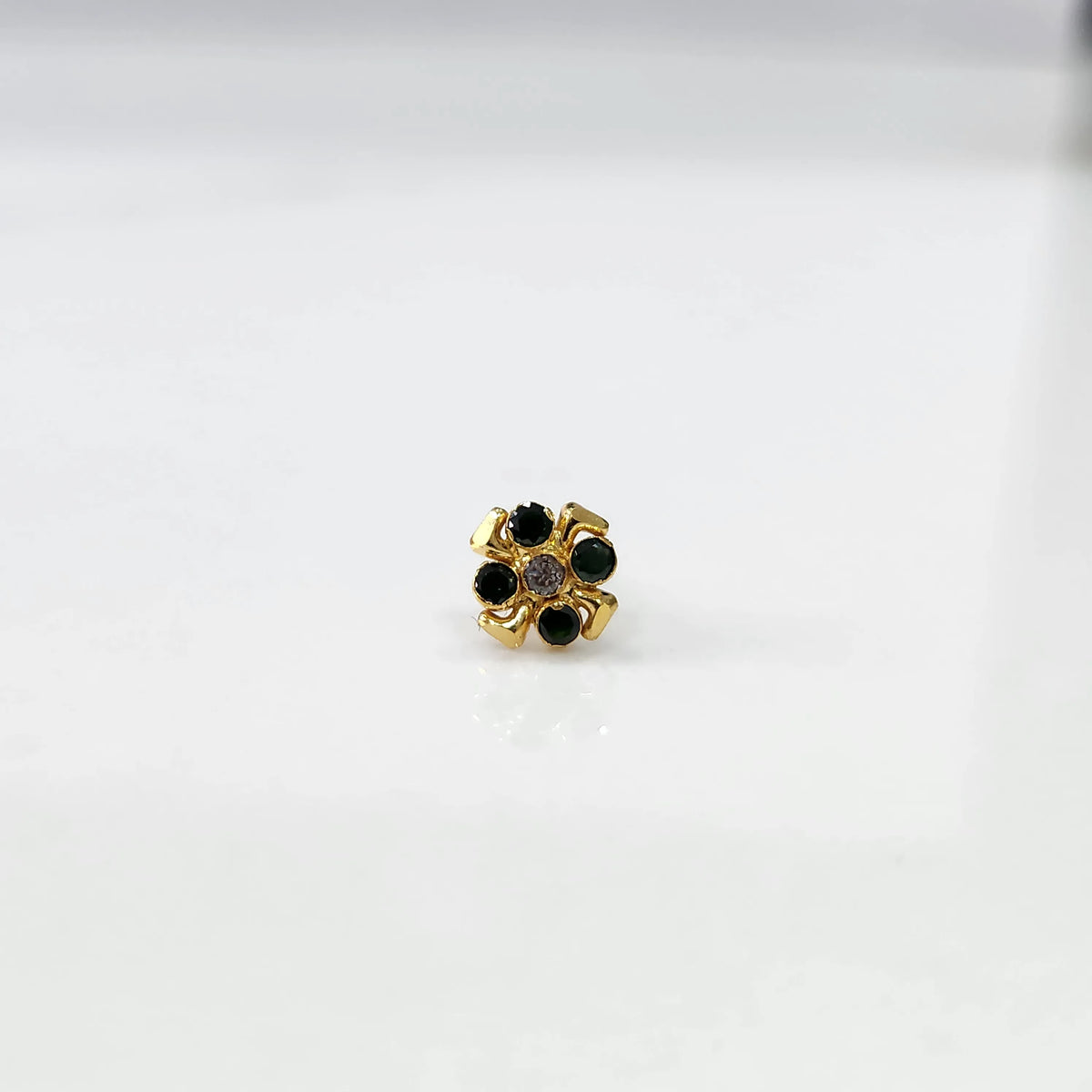 Gold ring with green emerald scalloped floral design, top view