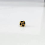 Gold ring with green emerald scalloped floral design, top view