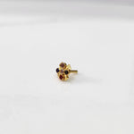 Gold ring with multicolor garnet scalloped floral design, top view