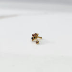 Gold ring with multicolor purple-toned scalloped floral design, side view