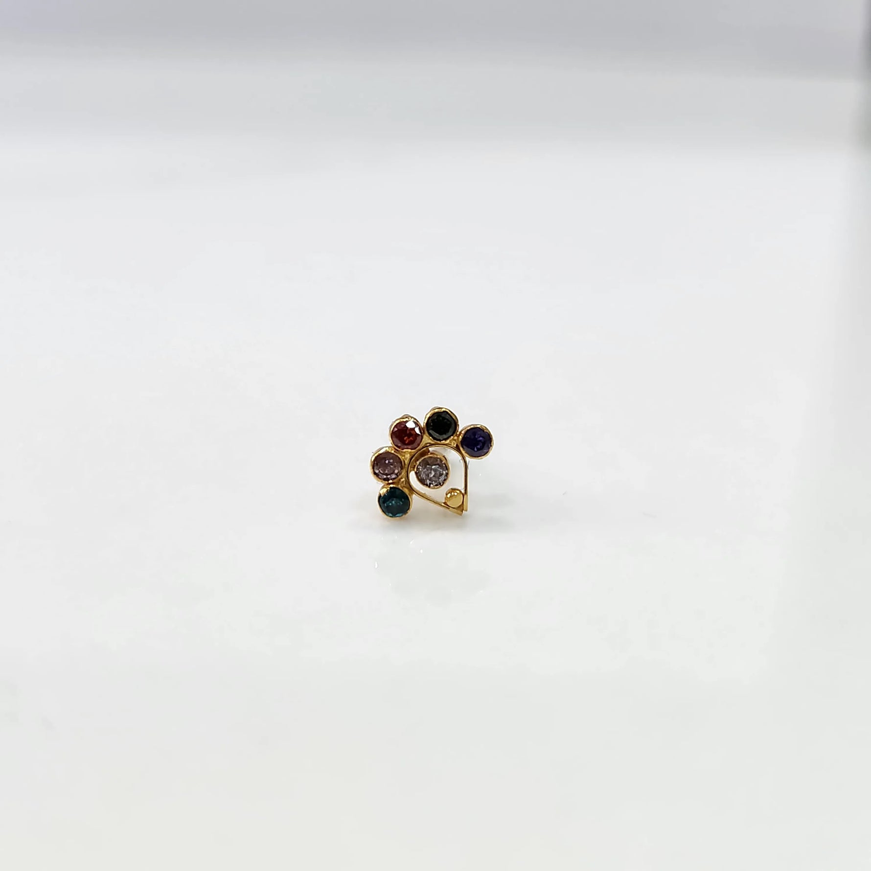 Gold ring with multicolor gemstone floral cluster design, front view