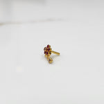 Antique-style gold ring with red-toned stones in floral dangle pattern