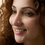Diamond snowflake design 18K gold nose pin worn by woman