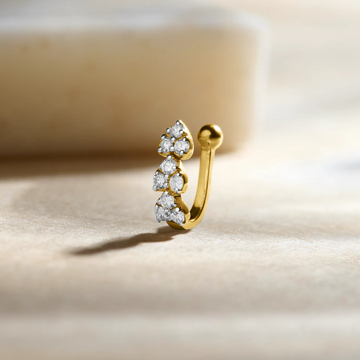 Curved diamond cluster hoop earring or nose ring in 14k gold with ball end