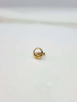 Side angle view of 18k gold nose pin design featuring smooth polished finish and contemporary appeal