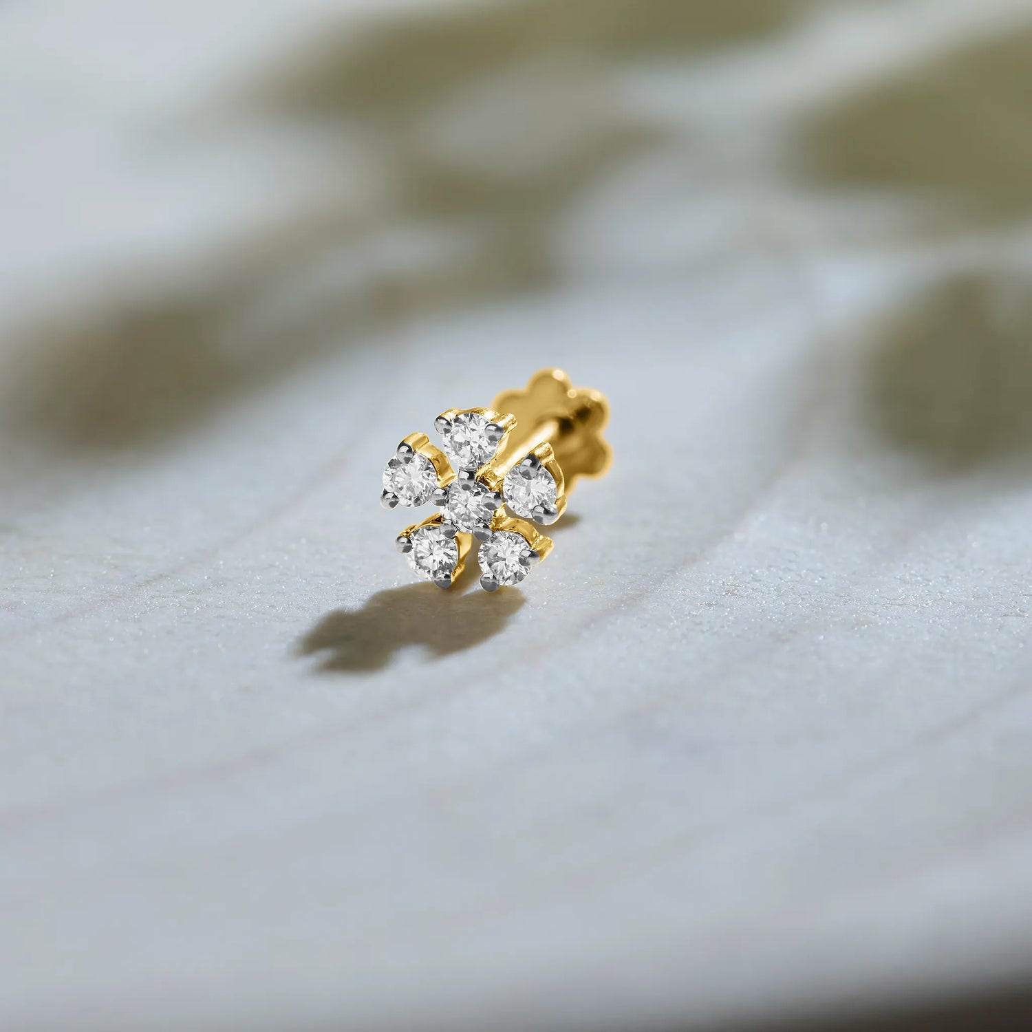 Five-petal flower diamond stud earring in 14k gold