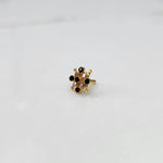 Delicate stone gold nose pin floral design close up