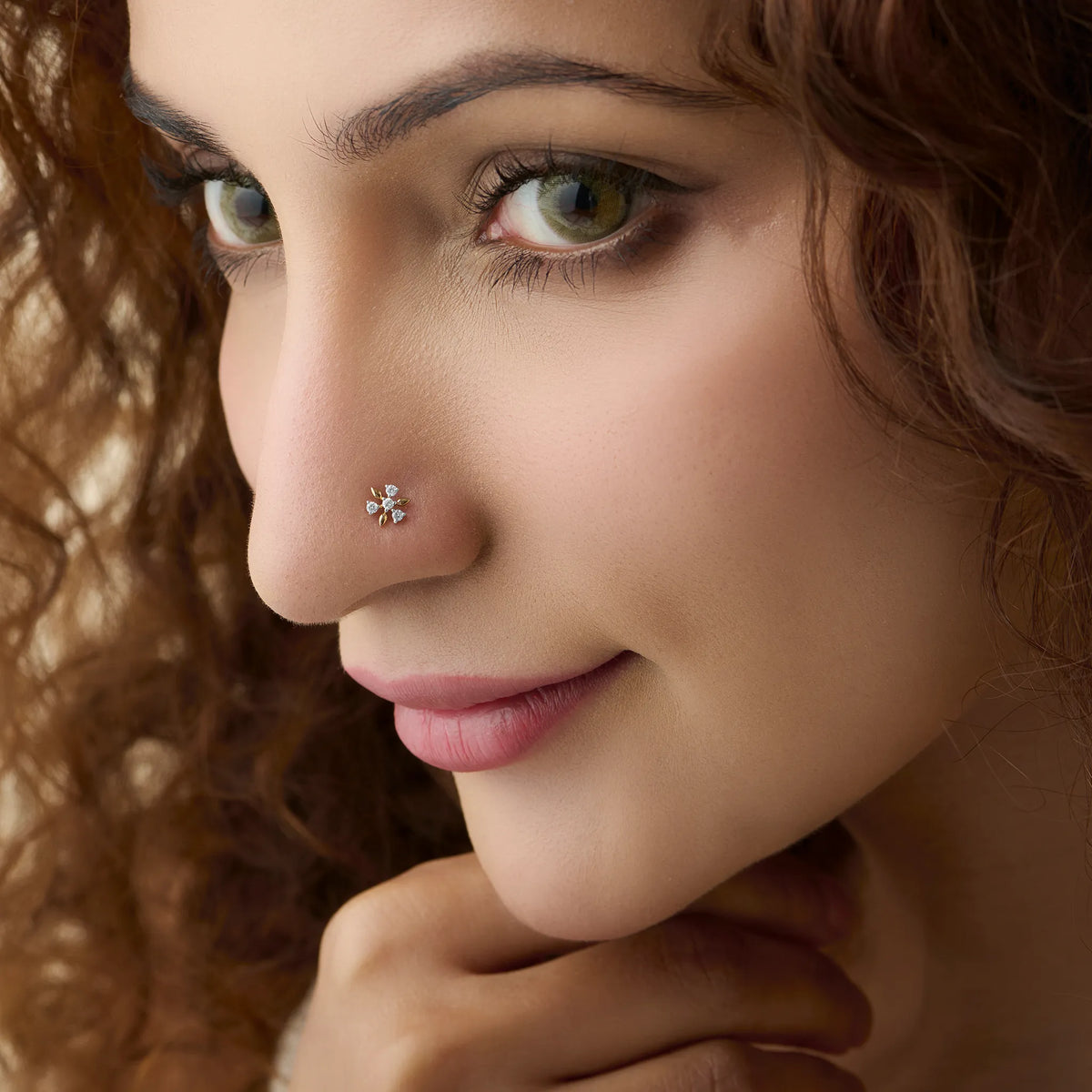 Model showcasing a delicate mini-bloom diamond nose pin