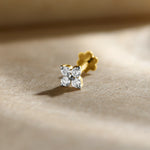 Four-stone diamond cluster stud earring arranged in a square pattern, gold