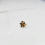 Gold nose pin with black gemstone mandala design on white background
