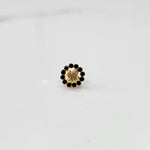 Gold black round nose pin with gemstone border, product shot
