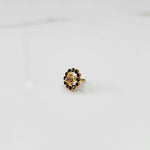 Gold round nose pin with black stones, product shot