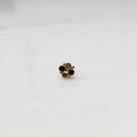 Gold floral nose pin with black and champagne stones, product shot
