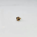 Gold floral ring with blue and brown gemstones