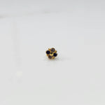 Gold floral nose pin with blue and gold stones, product shot