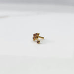 Side view of gold ring featuring pink gemstone cluster on branch design