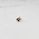 Gold statement ring with brown and purple gemstones in cluster leaf design