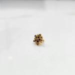 Gold statement ring with brown and purple gemstones in textured cluster design
