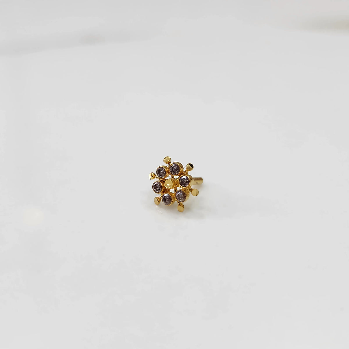 Gold statement ring with brown gemstones in scattered dotted cluster design
