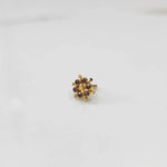 Gold statement ring with brown gemstones in scattered dotted cluster design