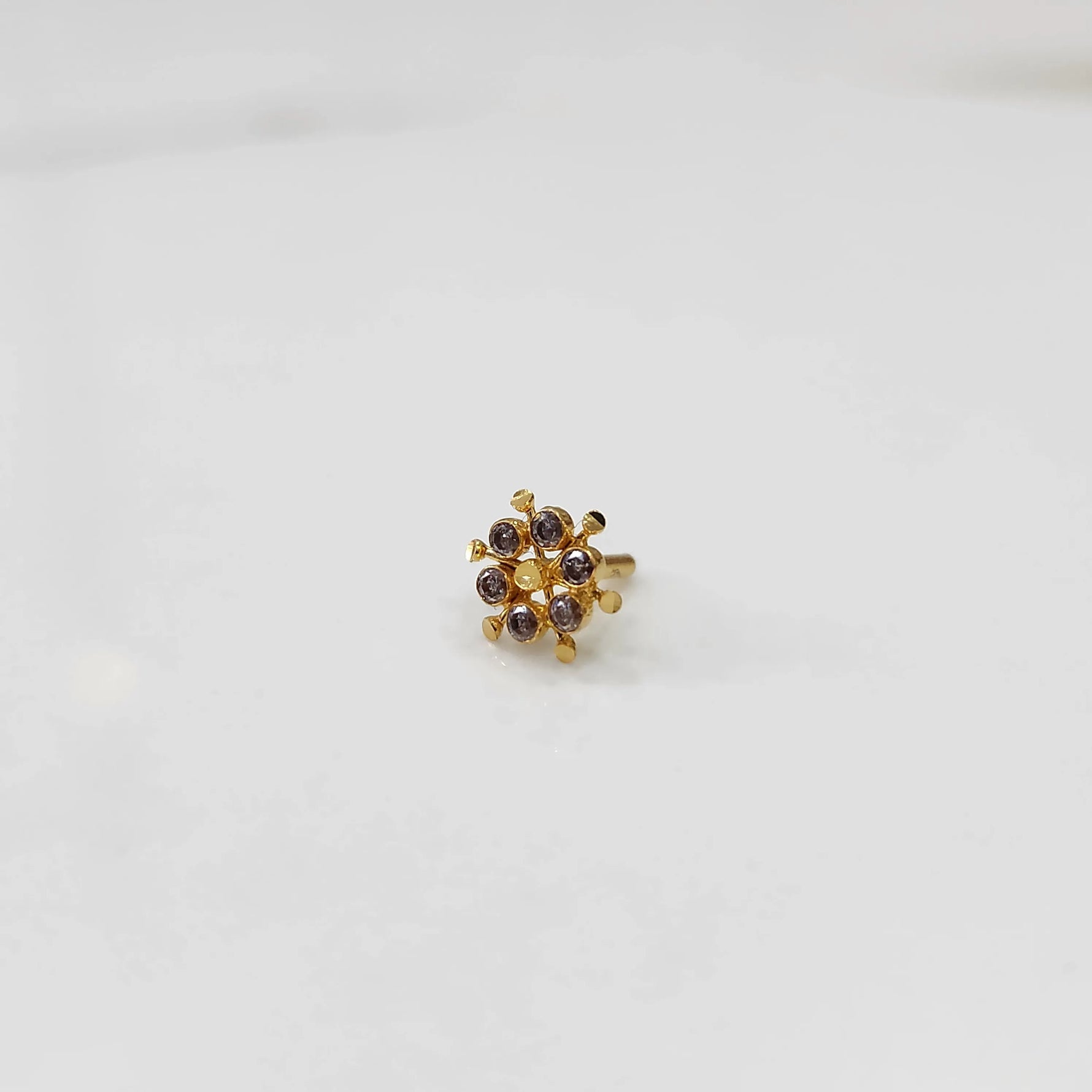 Gold statement ring with brown gemstones in scattered dotted cluster design