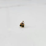 Gold nose pin with clear and green stones, product shot