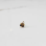 Gold statement ring with clear and purple gemstones in cluster leaf design