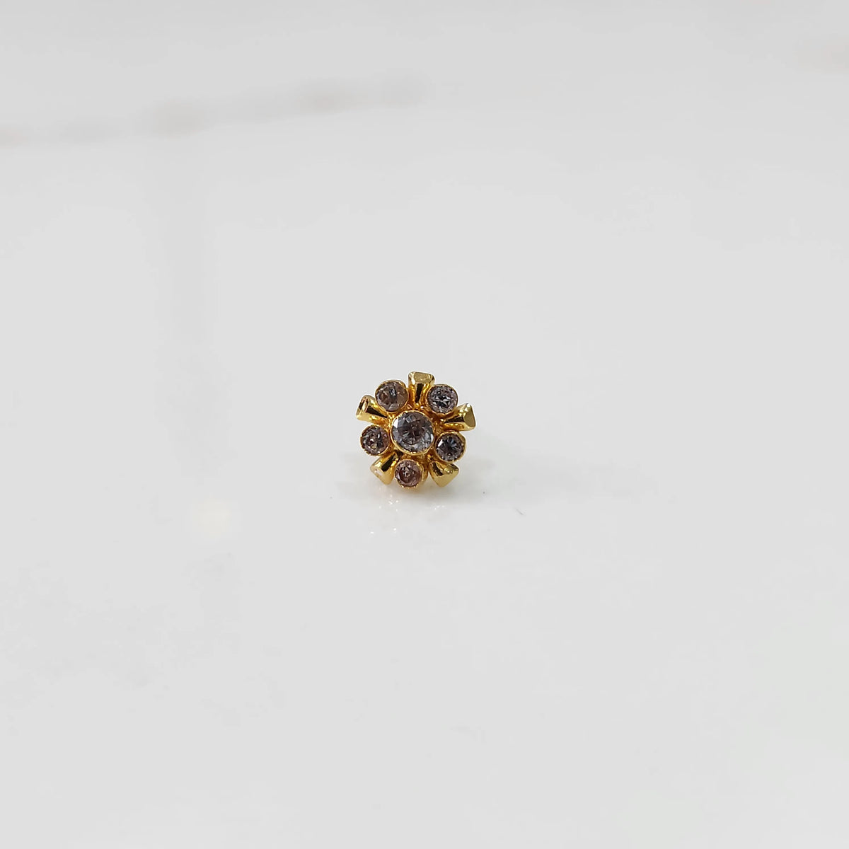 Gold floral nose pin with clear stones, product shot