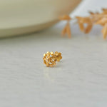 Gold round stud earring with cluster of flat discs