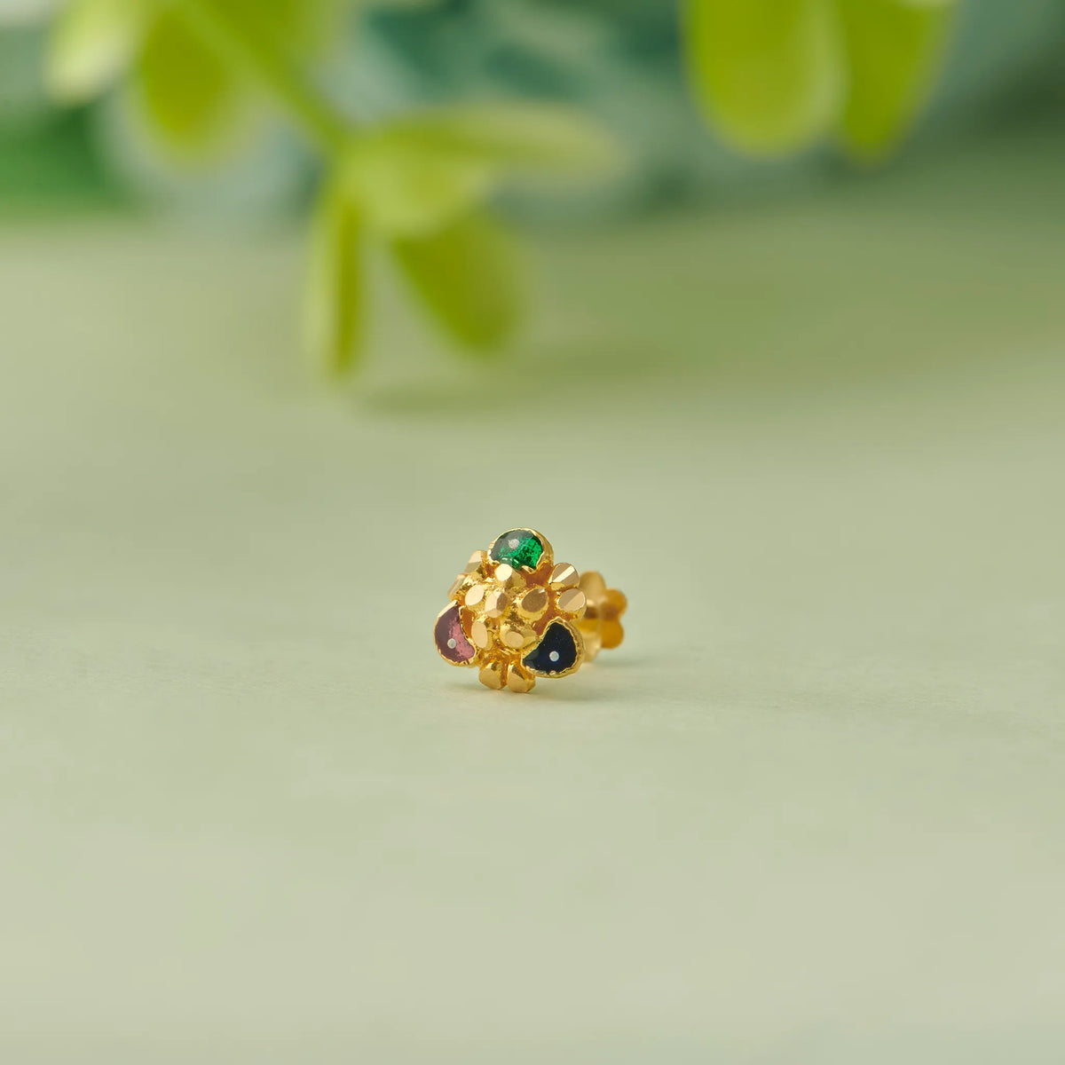 Gold cluster stud earring with multicolor gemstone accents