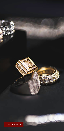Gold rings with square diamond design and pavé diamond band on black background