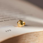 Gold textured flower stud earring, alternate angle
