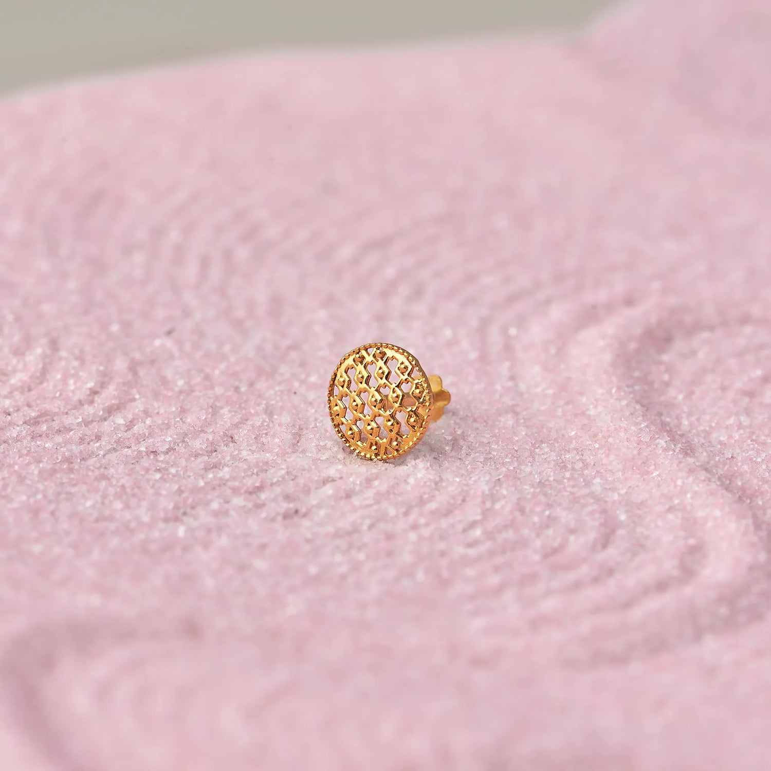 Gold domed stud earring with mesh cutout design