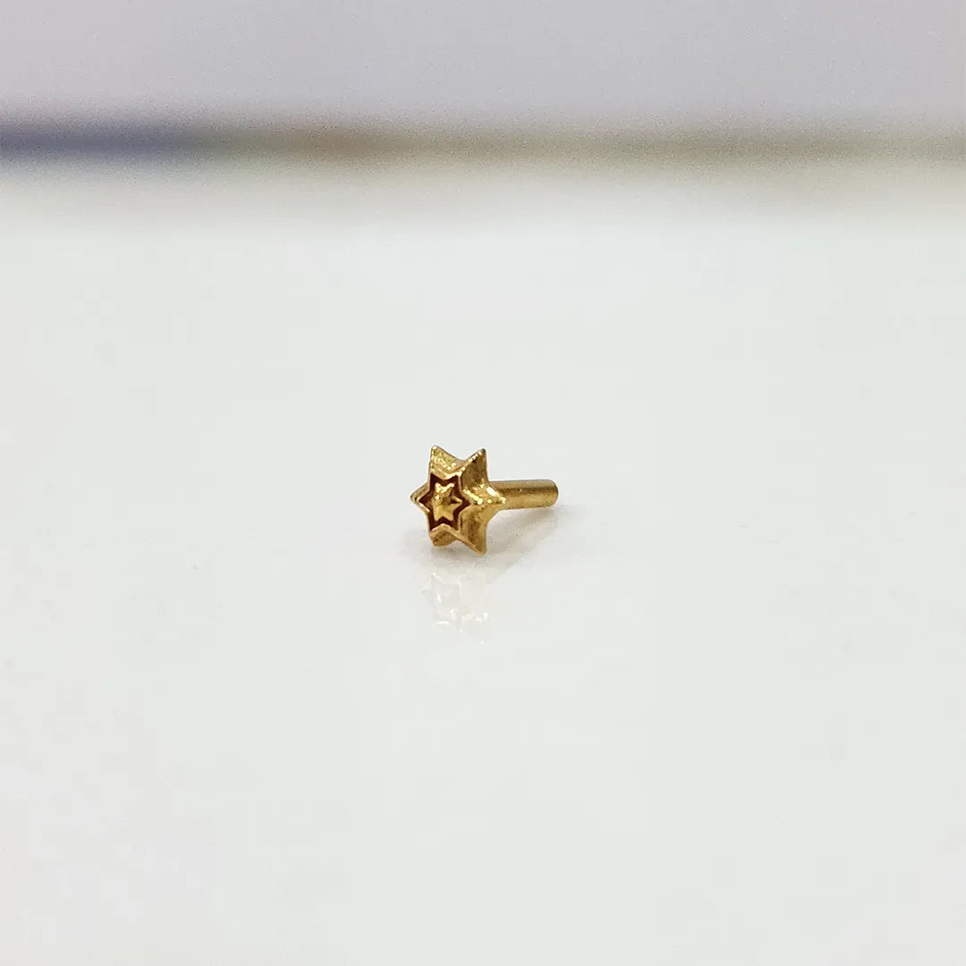 Simple gold nose pin design side angle with minimal star pattern