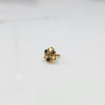 Gold filigree ring with green and lavender gemstones