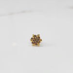 Gold-toned floral cluster cocktail ring with brown stones and leaf detailing