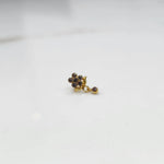 Antique-style gold ring with smoky-toned stones in floral dangle pattern
