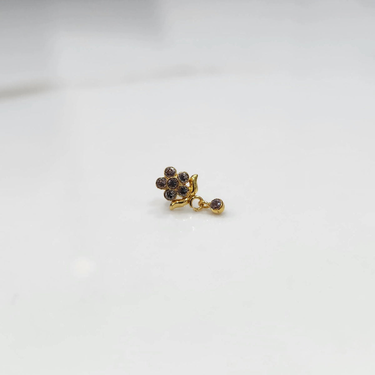 Antique-style gold ring with smoky-toned stones in floral dangle pattern