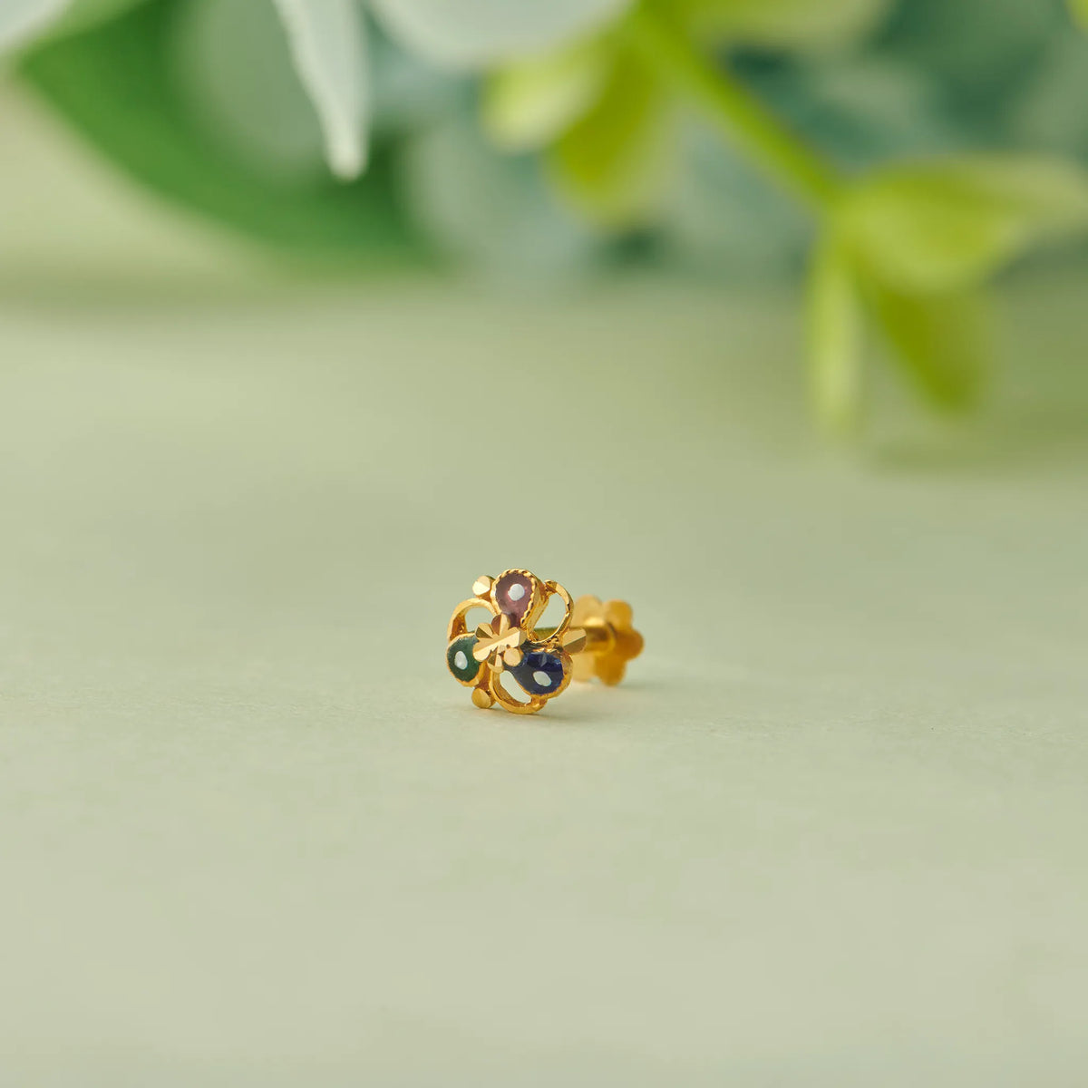 Gold floral stud earring with multicolor gemstone accents