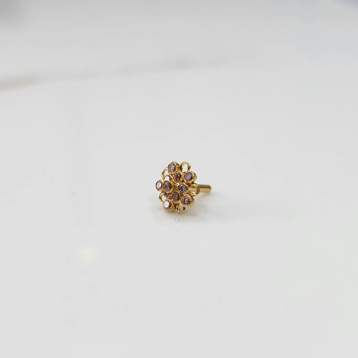 Gold floral nose pin with round stone detailing