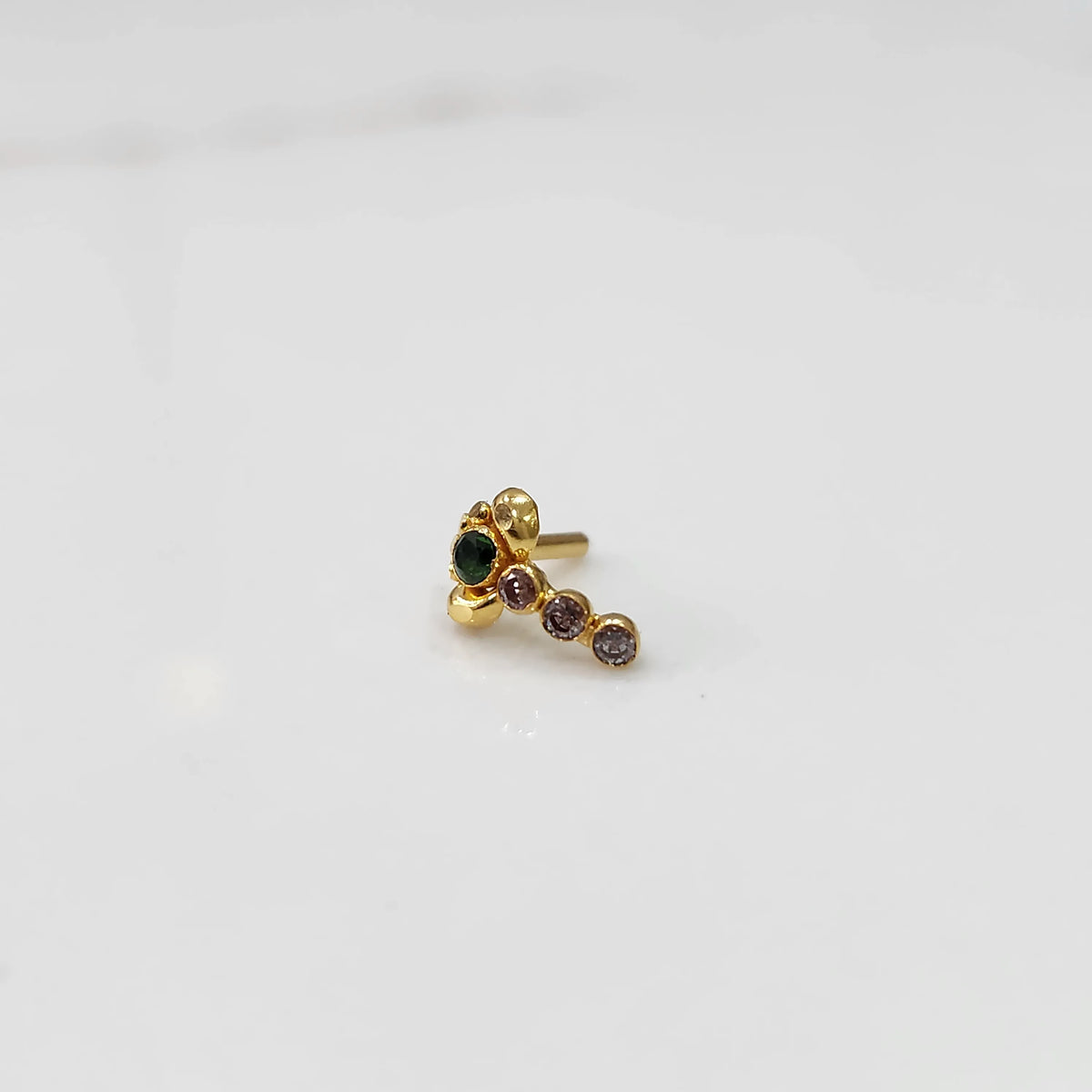 Gold nose pin with green floral head and pink stone trail