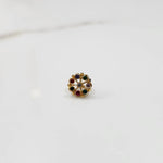 Gold flower ring with multicolor cabochon gemstones, front view