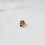 Full front view of gold ring with multicolor gemstone petals
