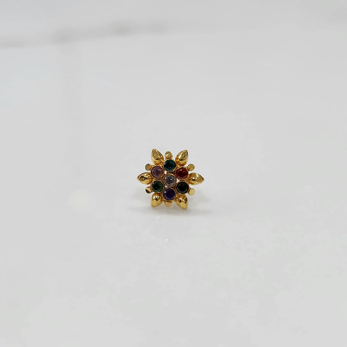 Gold flower ring with multicolor gemstones, full front view