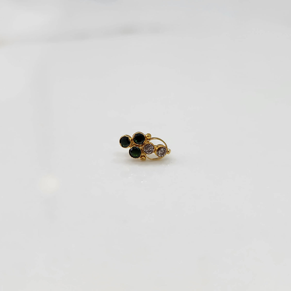 Gold ring with green and clear round gemstone cluster design