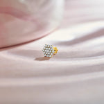 Pave CZ hexagon cluster stud with gold rim setting, jewelry photography