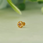 Gold lattice flower stud earring with pink stone center