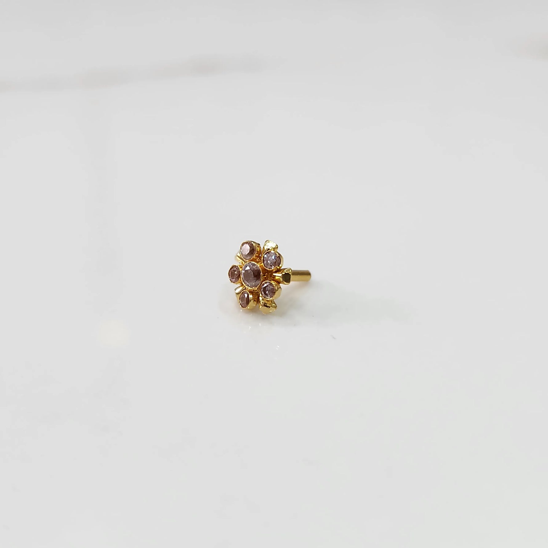 Gold floral nose pin with lavender stones, product shot