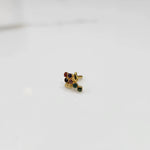 Side view of gold ring featuring multicolor gemstone cluster with leaf and drop accent